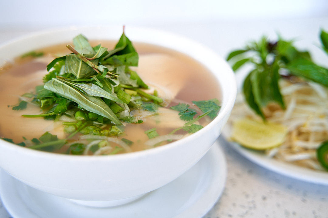 Traditional Vietnamese Pho Ga with chicken and fresh herbs